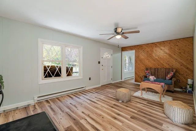 a bedroom with furniture and a chandelier