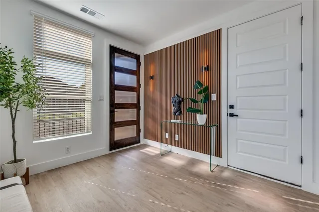 an empty room with window and furniture