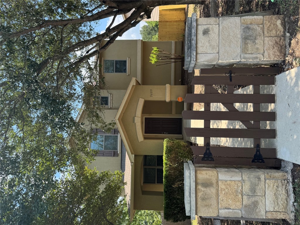 5609 Viewpoint Drive Austin, TX 78744 - Photo 1 of 21 a front view of a house with glass windows