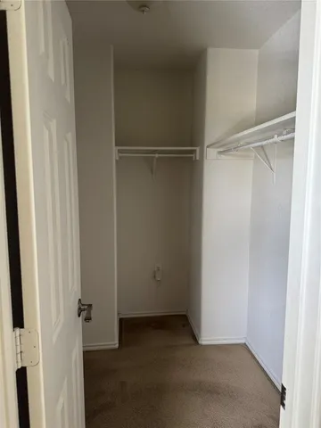 a view of room with a ceiling fan