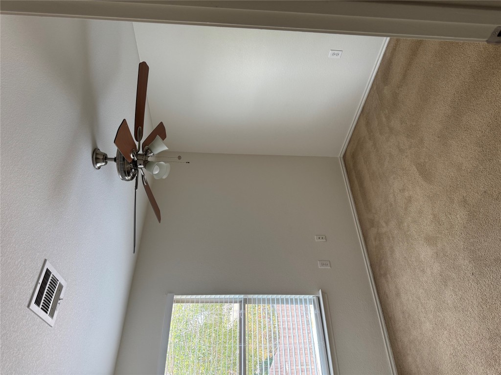 5609 Viewpoint Drive Austin, TX 78744 - Photo 17 of 21 an empty room with a window and a fan