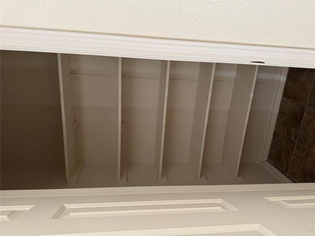5609 Viewpoint Drive Austin, TX 78744 - Photo 9 of 21 a view of walk in closet with empty racks