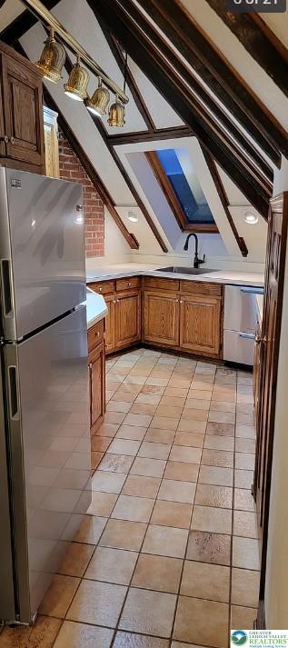 444 West 3rd Street, Unit 9 Bethlehem, PA 18015 - Photo 5 of 16 A quaint kitchen with warm wood cabinetry and unique sloped ceilings features a skylight.