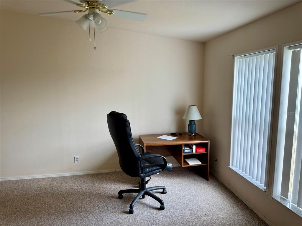 1644 Ibis Court Punta Gorda, FL 33982 - Photo 13 of 42 a view of a workspace with furniture and a window
