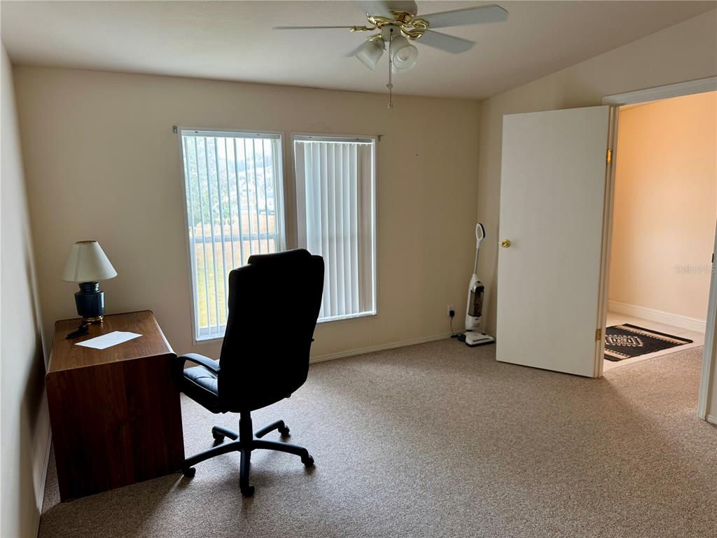 1644 Ibis Court Punta Gorda, FL 33982 - Photo 14 of 42 a view of a workspace with furniture and a window