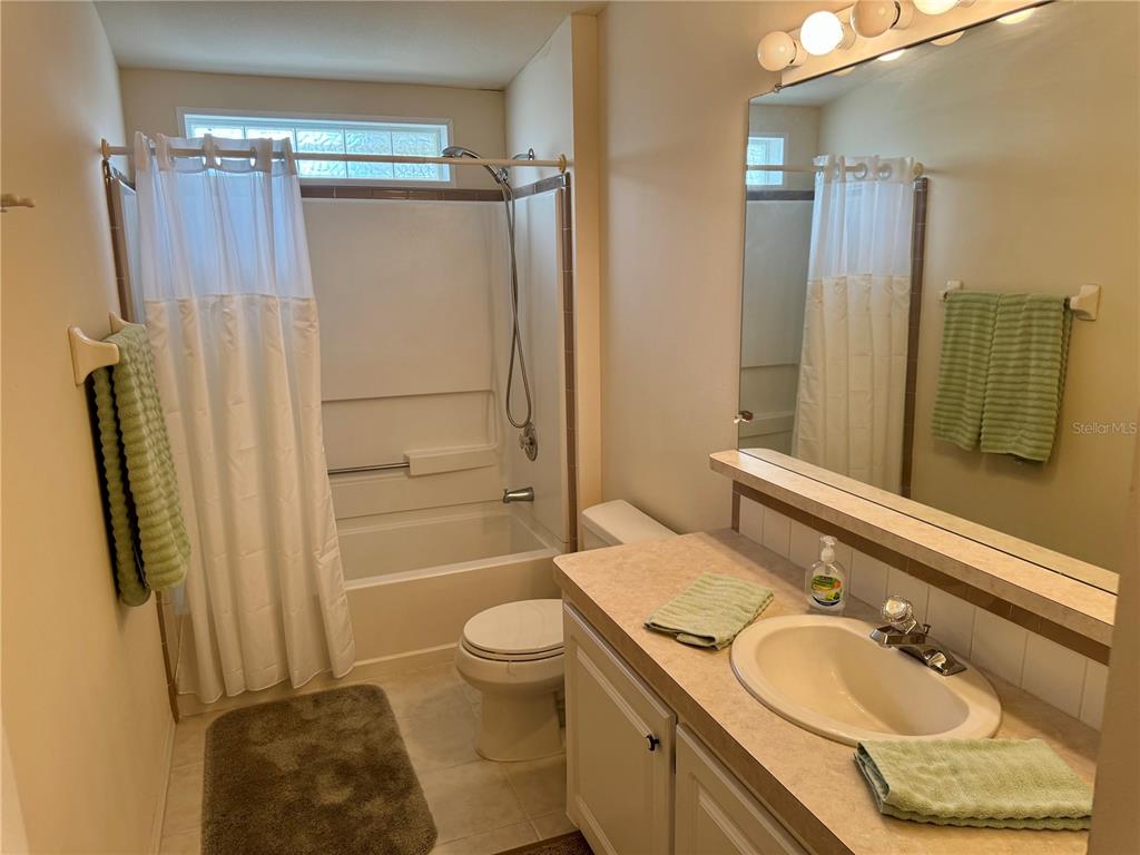 1644 Ibis Court Punta Gorda, FL 33982 - Photo 22 of 42 a bathroom with a granite countertop sink toilet and shower