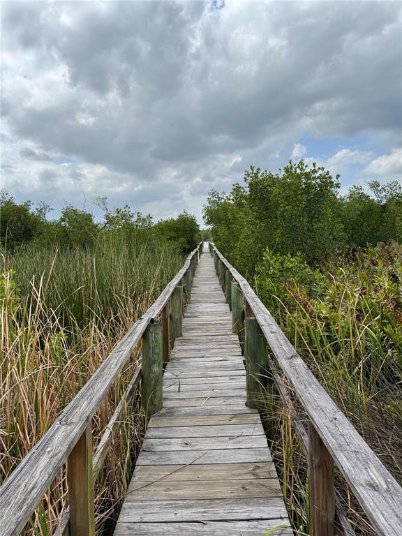 1644 Ibis Court Punta Gorda, FL 33982 - Photo 27 of 42 a view of a wooden bridge from a balcony