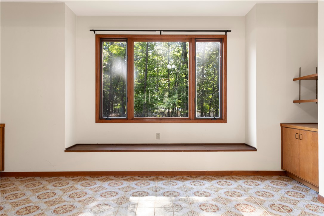 1298 Carradine Road Seneca, SC 29678 - Photo 21 of 43 A reading nook with a breathtaking view doubles as hidden storage.