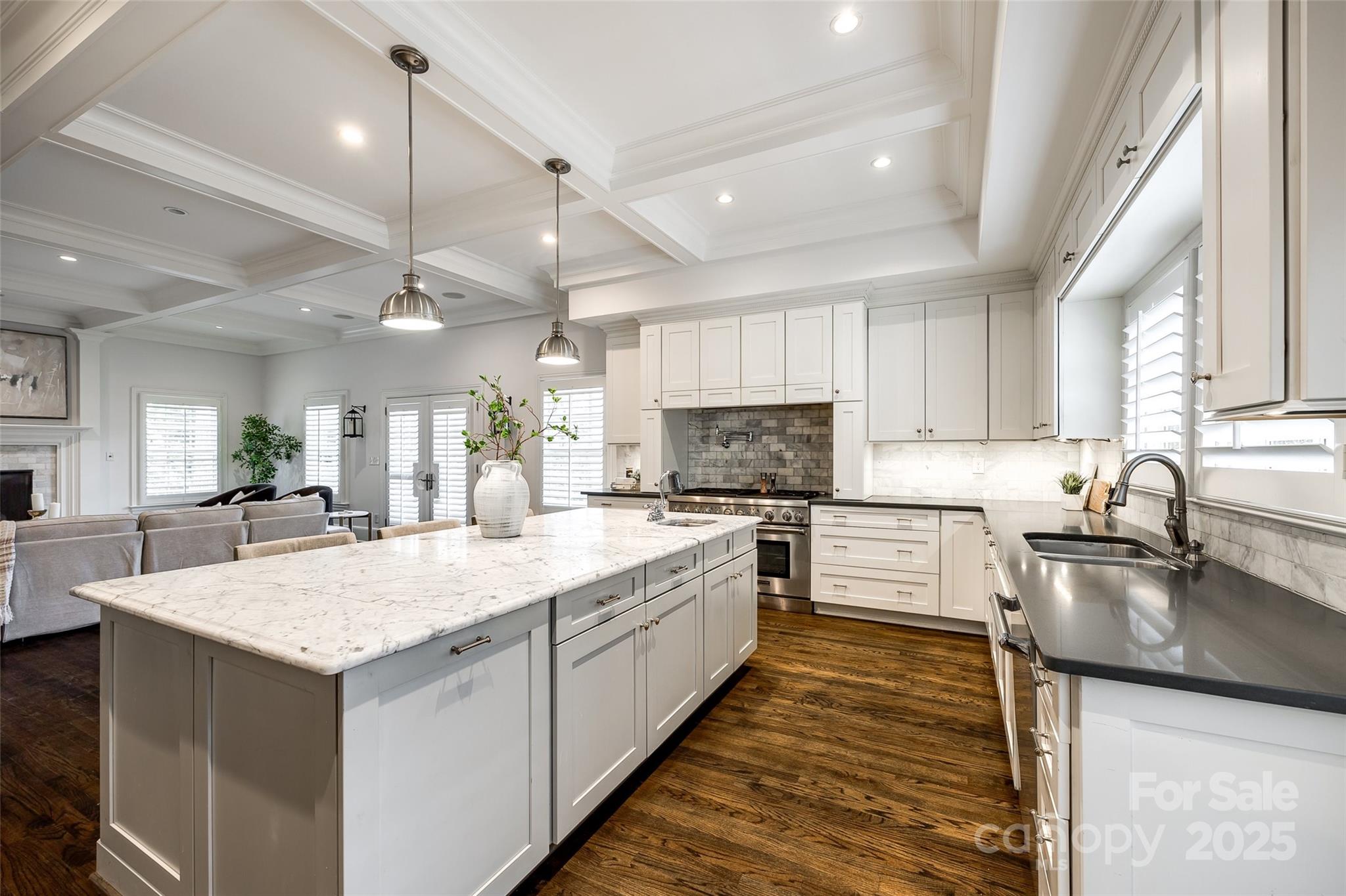 1225 Providence Road Charlotte, NC 28207 - Photo 14 of 42 a large kitchen with kitchen island a sink stainless steel appliances and cabinets