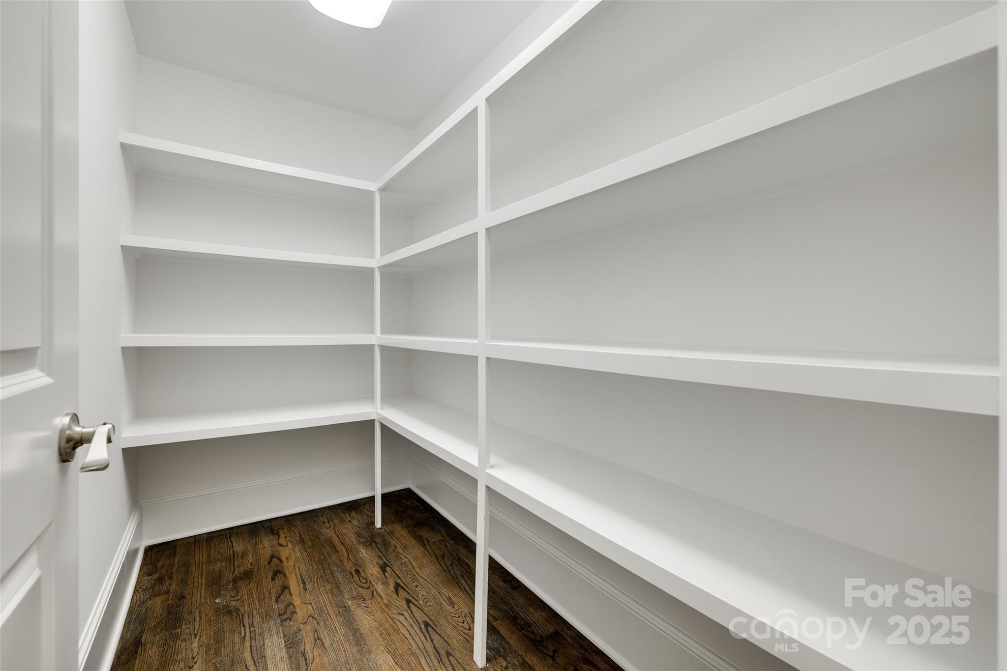 1225 Providence Road Charlotte, NC 28207 - Photo 16 of 42 a view of walk in closet with empty racks