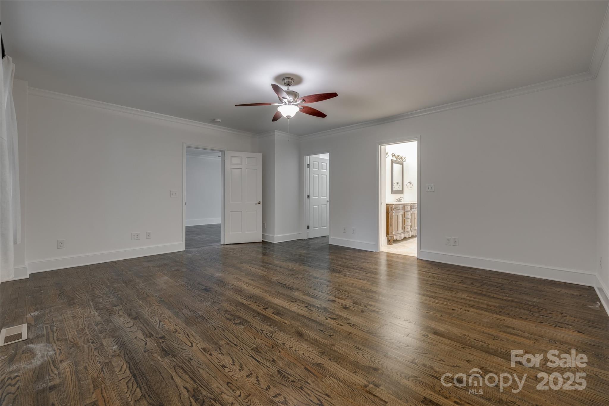 1225 Providence Road Charlotte, NC 28207 - Photo 20 of 42 a view of an empty room with a window and wooden floor