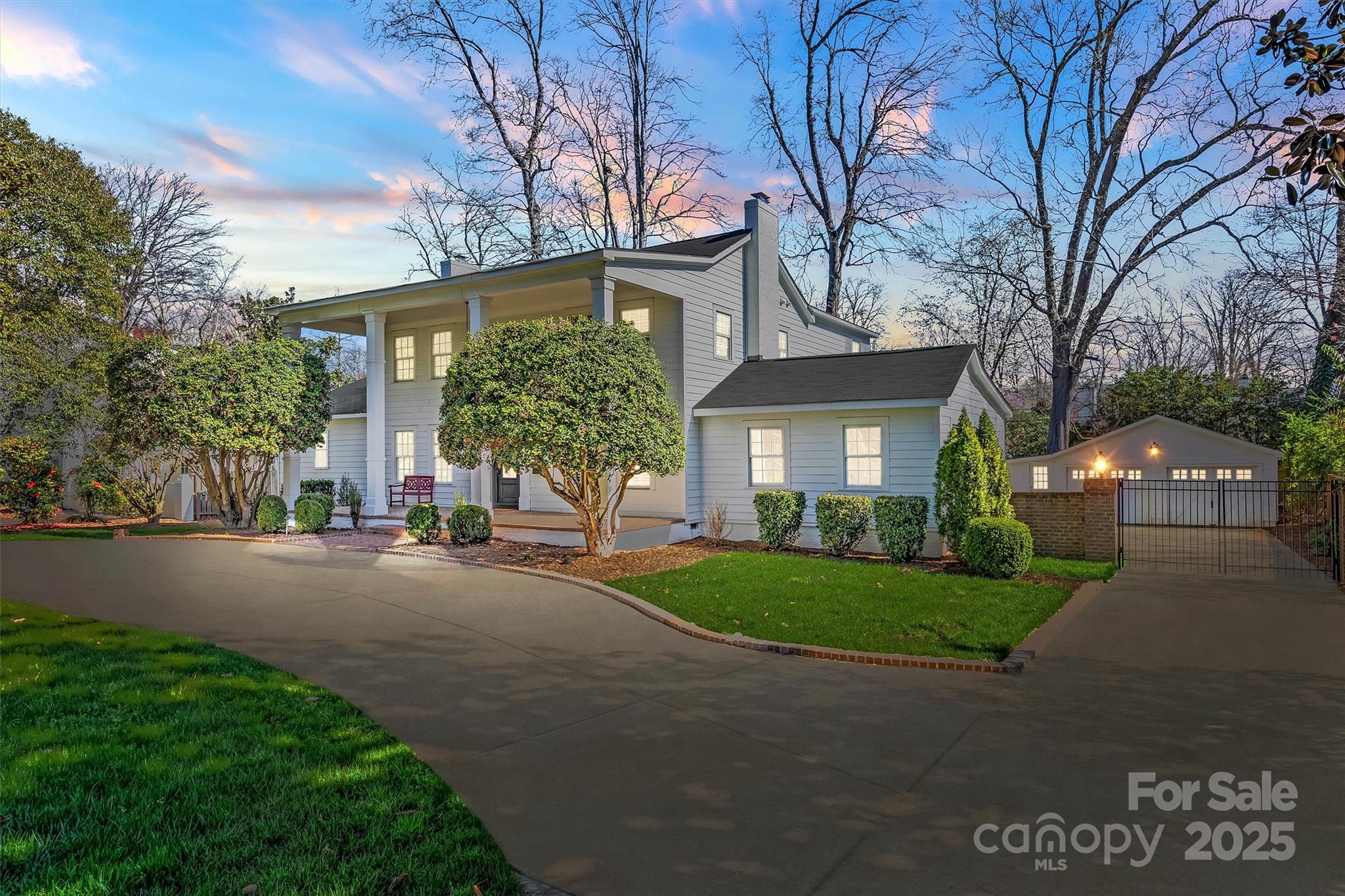 1225 Providence Road Charlotte, NC 28207 - Photo 2 of 42 a view of a house with a yard and garage