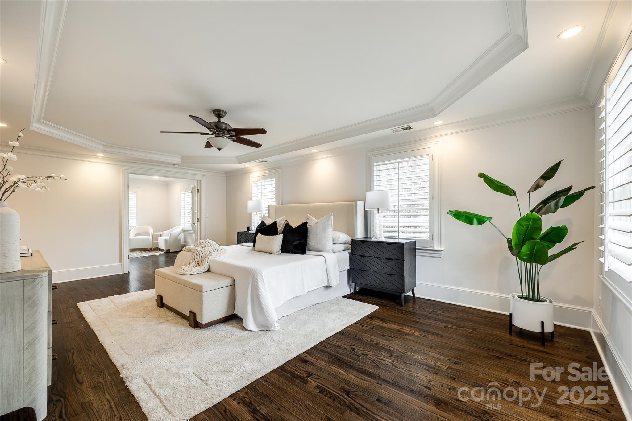 1225 Providence Road Charlotte, NC 28207 - Photo 25 of 42 a bed room with furniture and a potted plant