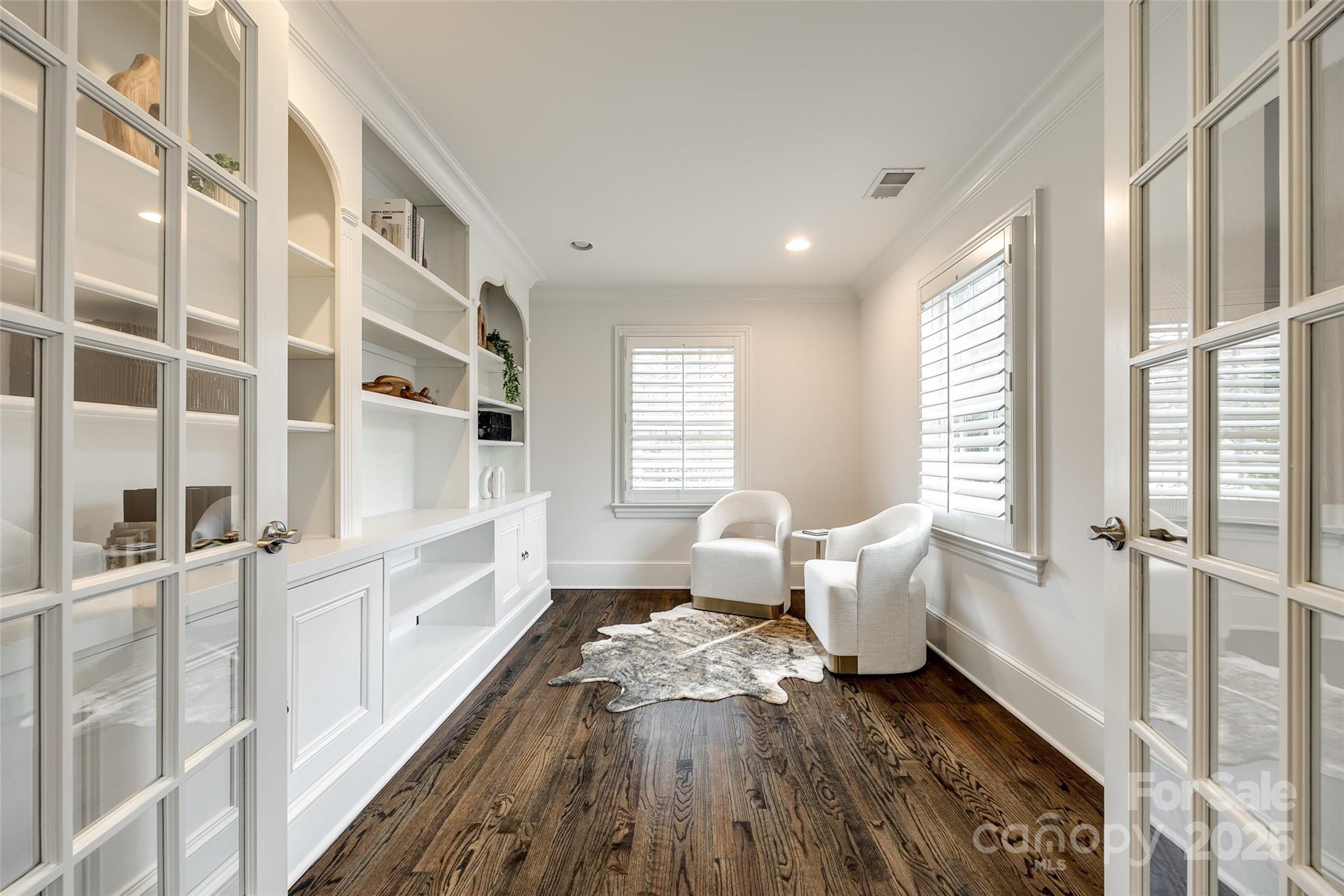 1225 Providence Road Charlotte, NC 28207 - Photo 27 of 42 a living room with furniture and wooden floor