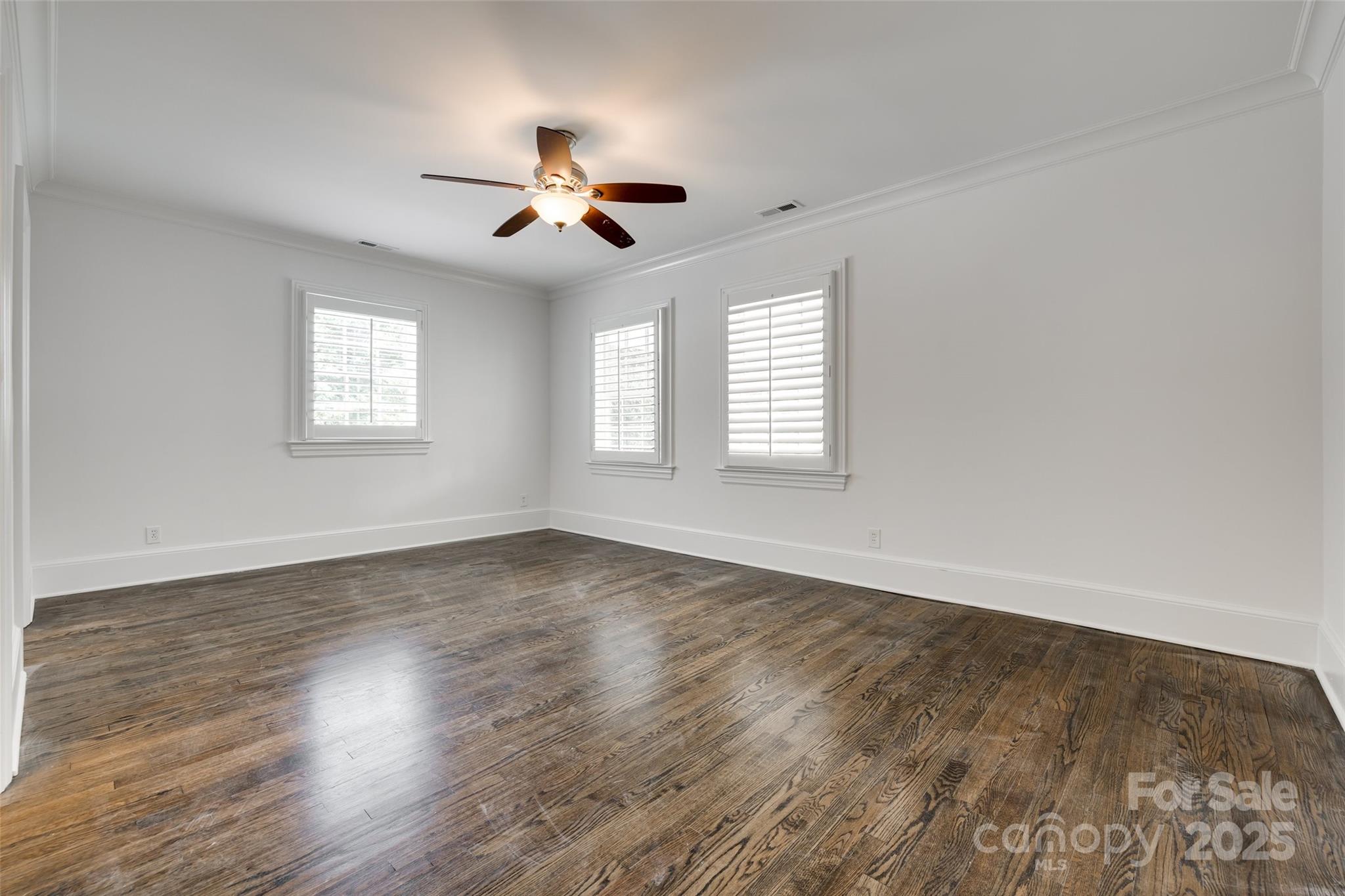 1225 Providence Road Charlotte, NC 28207 - Photo 31 of 42 a view of an empty room with wooden floor and a window