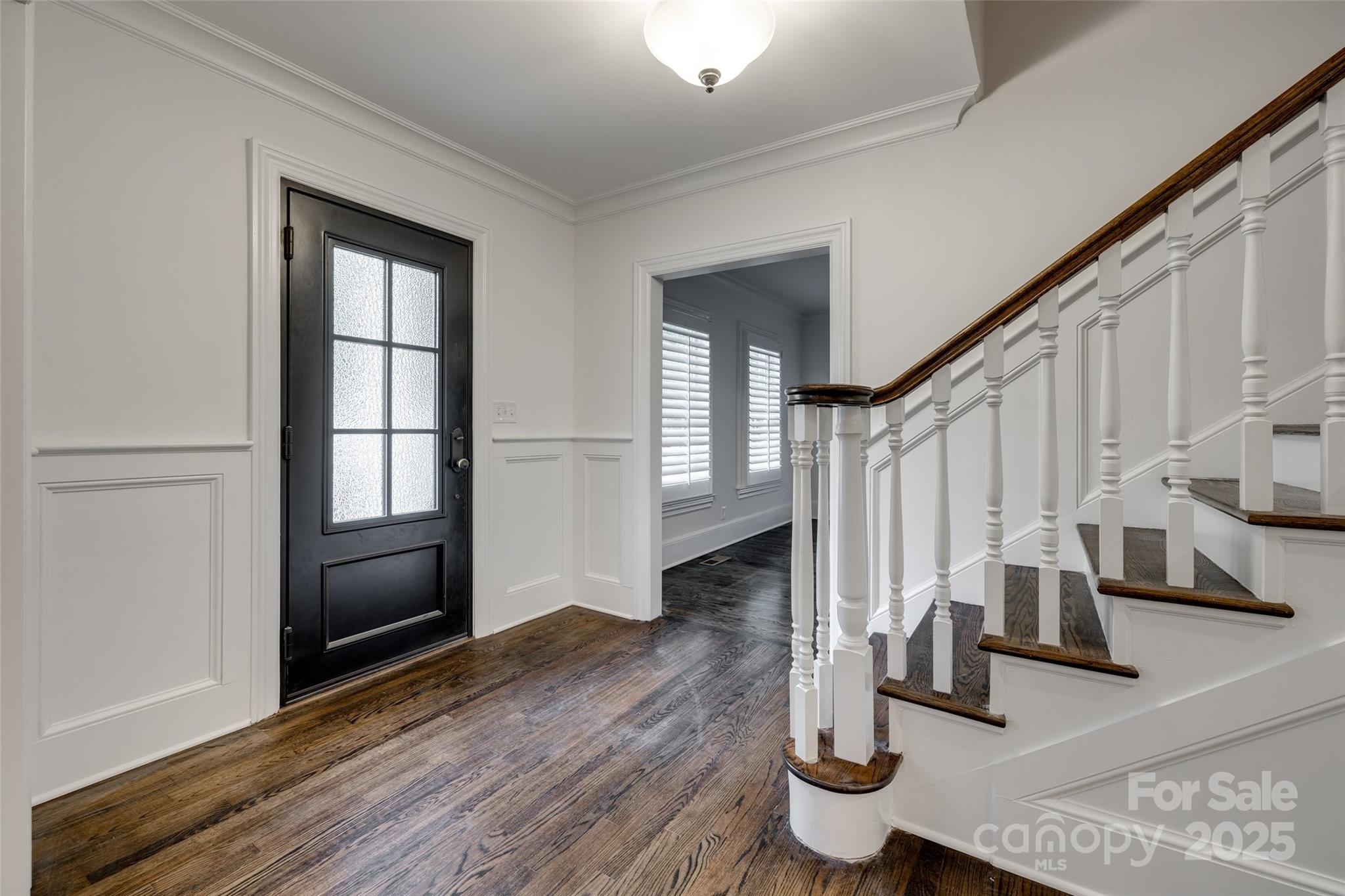 1225 Providence Road Charlotte, NC 28207 - Photo 5 of 42 a view of entryway and hall with wooden floor