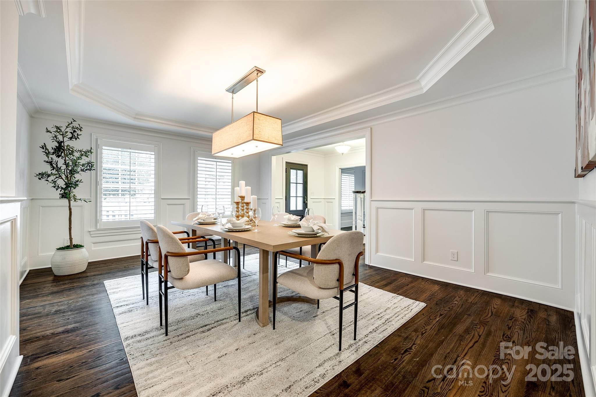1225 Providence Road Charlotte, NC 28207 - Photo 7 of 42 a view of a dining room with furniture and wooden floor