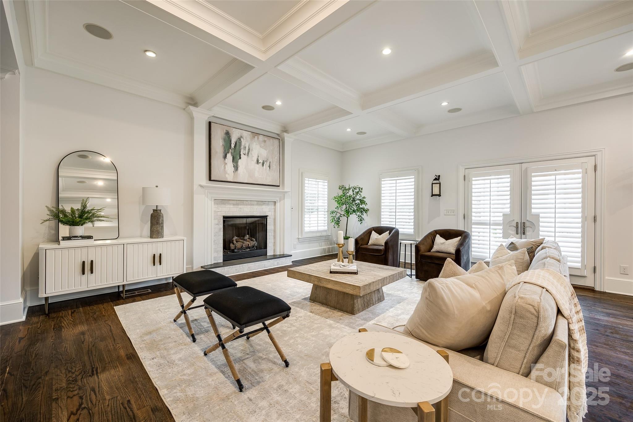 1225 Providence Road Charlotte, NC 28207 - Photo 10 of 42 a living room with furniture a fireplace and a flat screen tv