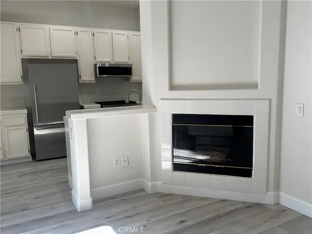 a kitchen with a stove and a refrigerator