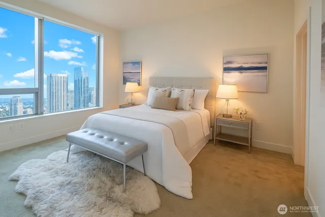 a bedroom with a bed a lamp and window