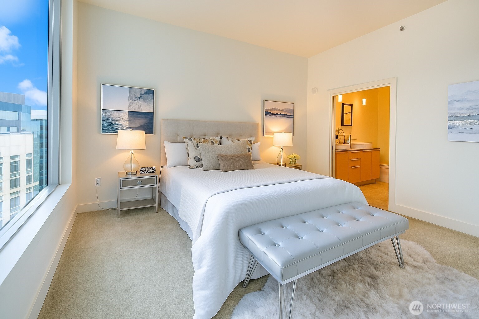 737 Olive Way, Unit 2908 Seattle, WA 98101 - Photo 14 of 35 a bedroom with a bed and a window