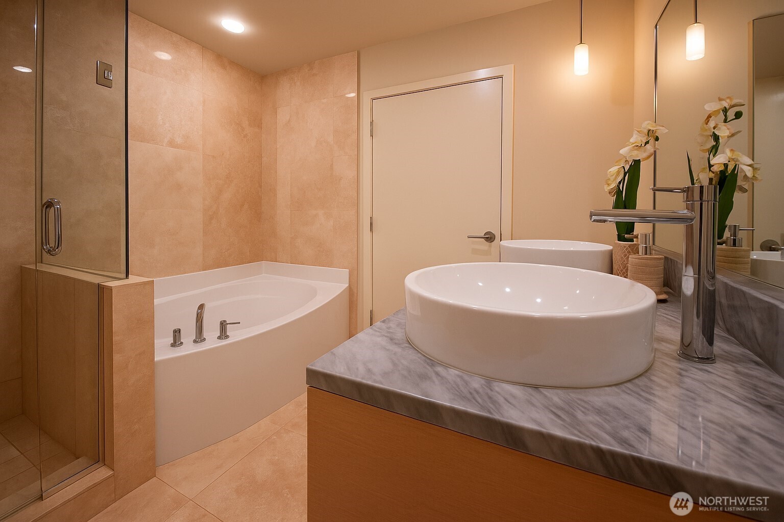 737 Olive Way, Unit 2908 Seattle, WA 98101 - Photo 16 of 35 a bathroom with a tub a sink and mirror