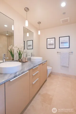a bathroom with a sink a vanity and a mirror
