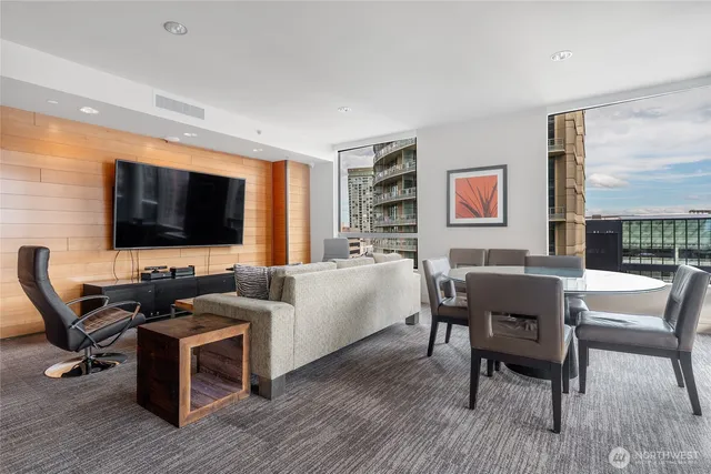 a living room with furniture and flowers