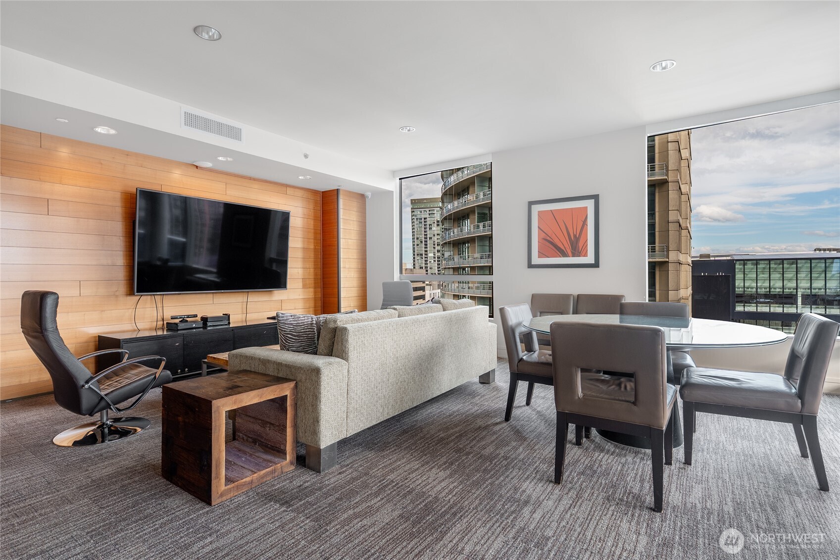 737 Olive Way, Unit 2908 Seattle, WA 98101 - Photo 26 of 35 a living room with furniture and a flat screen tv