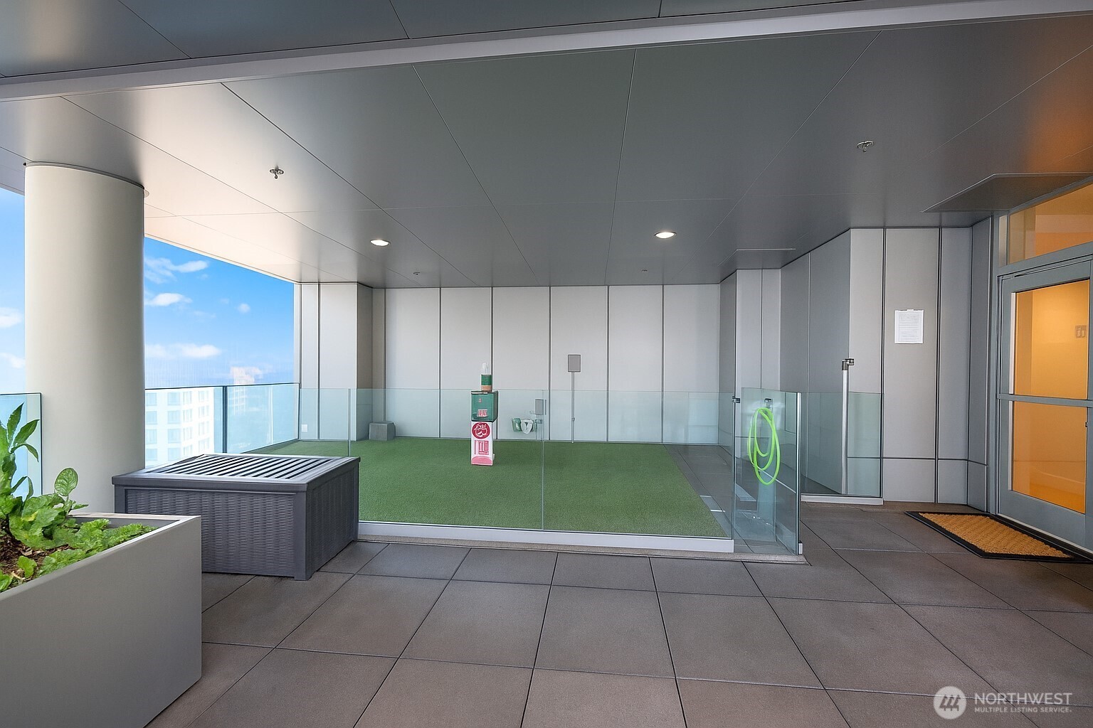 737 Olive Way, Unit 2908 Seattle, WA 98101 - Photo 30 of 35 a view of an empty room with kitchen and windows