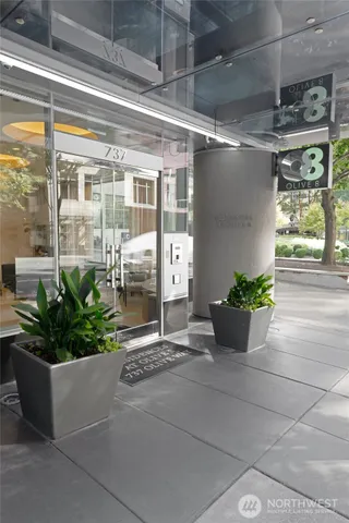 a building with potted plants in front of it