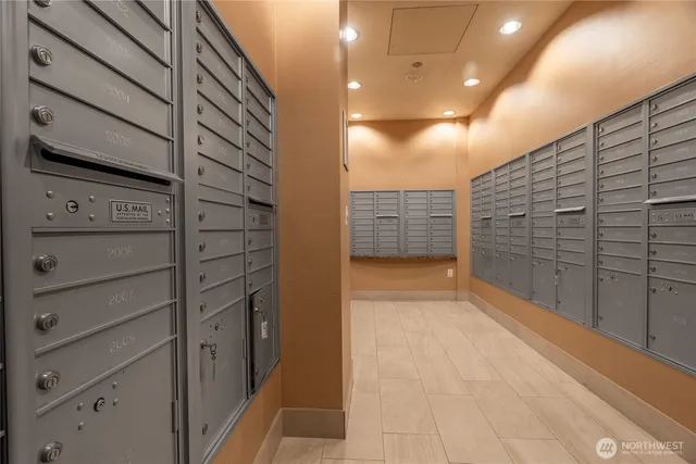 a large swimming pool with lawn chairs