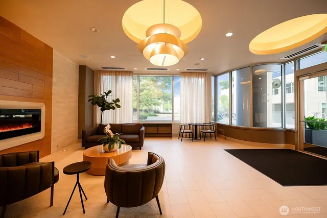 a living room with furniture and a large window