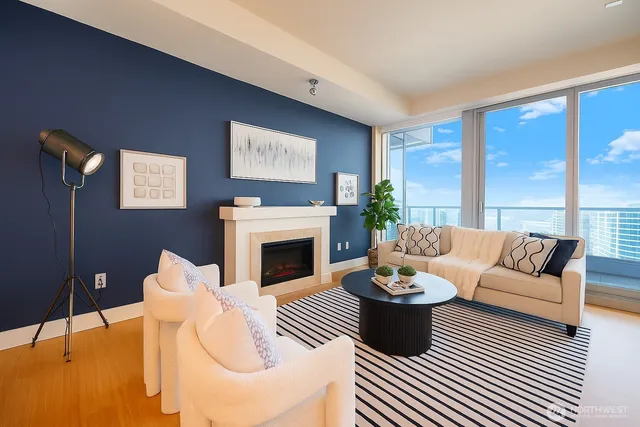 a living room with furniture a fireplace and a table