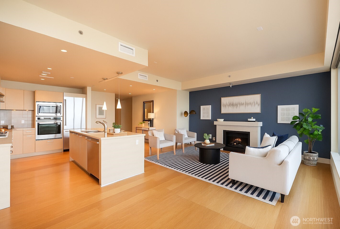 737 Olive Way, Unit 2908 Seattle, WA 98101 - Photo 9 of 35 a living room with furniture and a fireplace