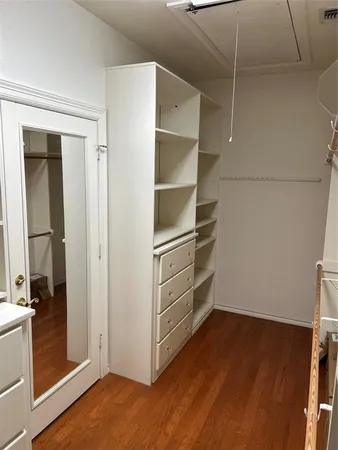 a view of an empty walk in closet