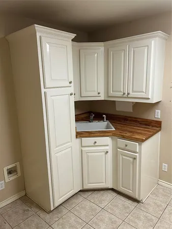 a view of kitchen with cabinets and outdoor space