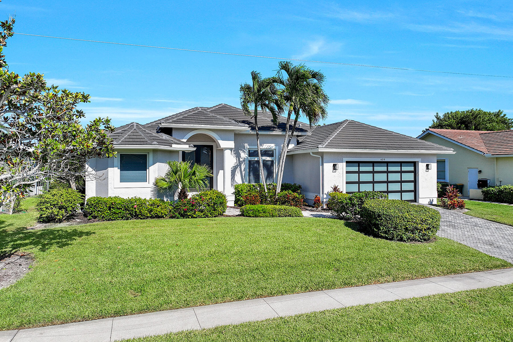a front view of a house with a yard