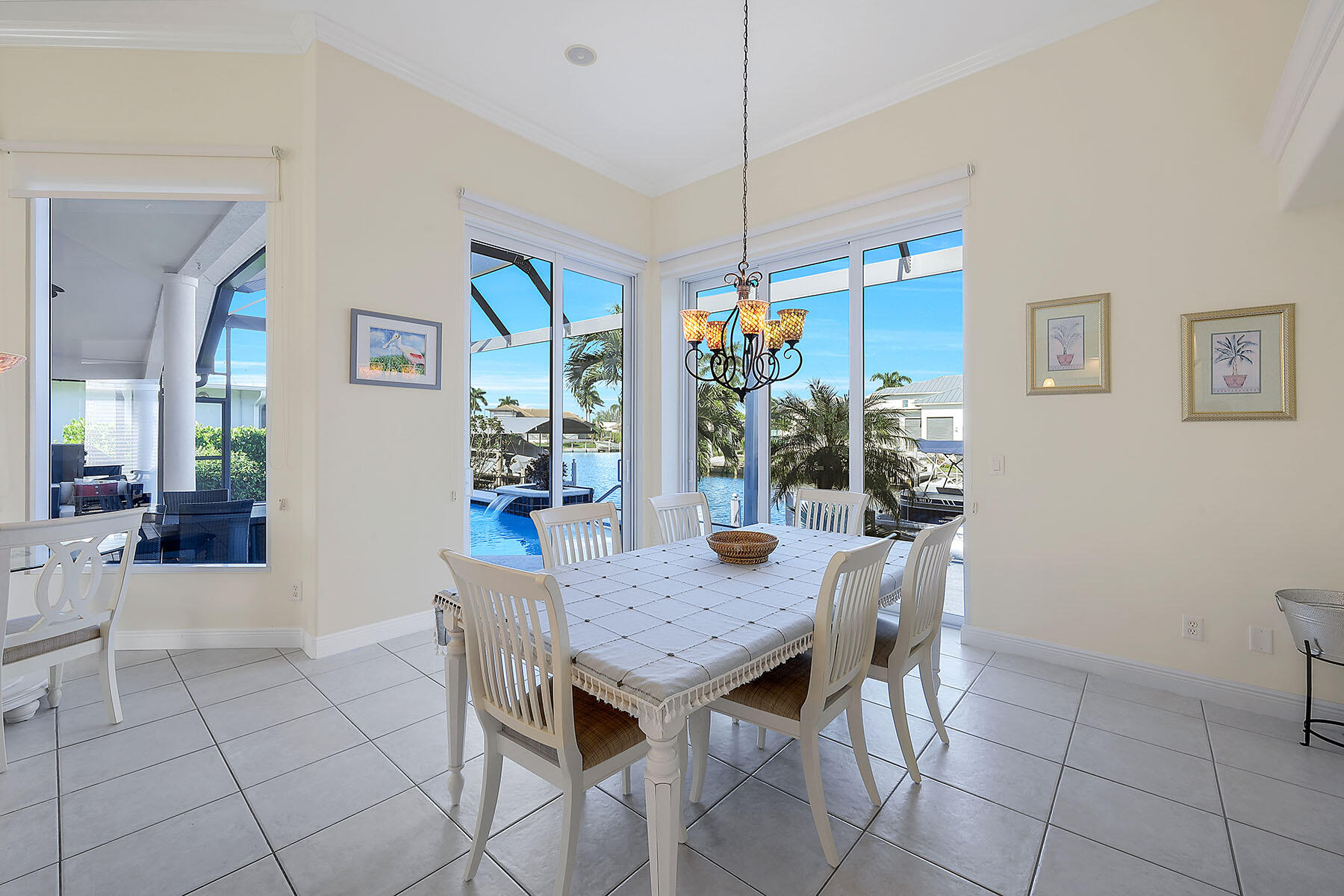 409 Waterleaf Court Marco Island, FL 34145 - Photo 11 of 38 a view of a dining room with furniture