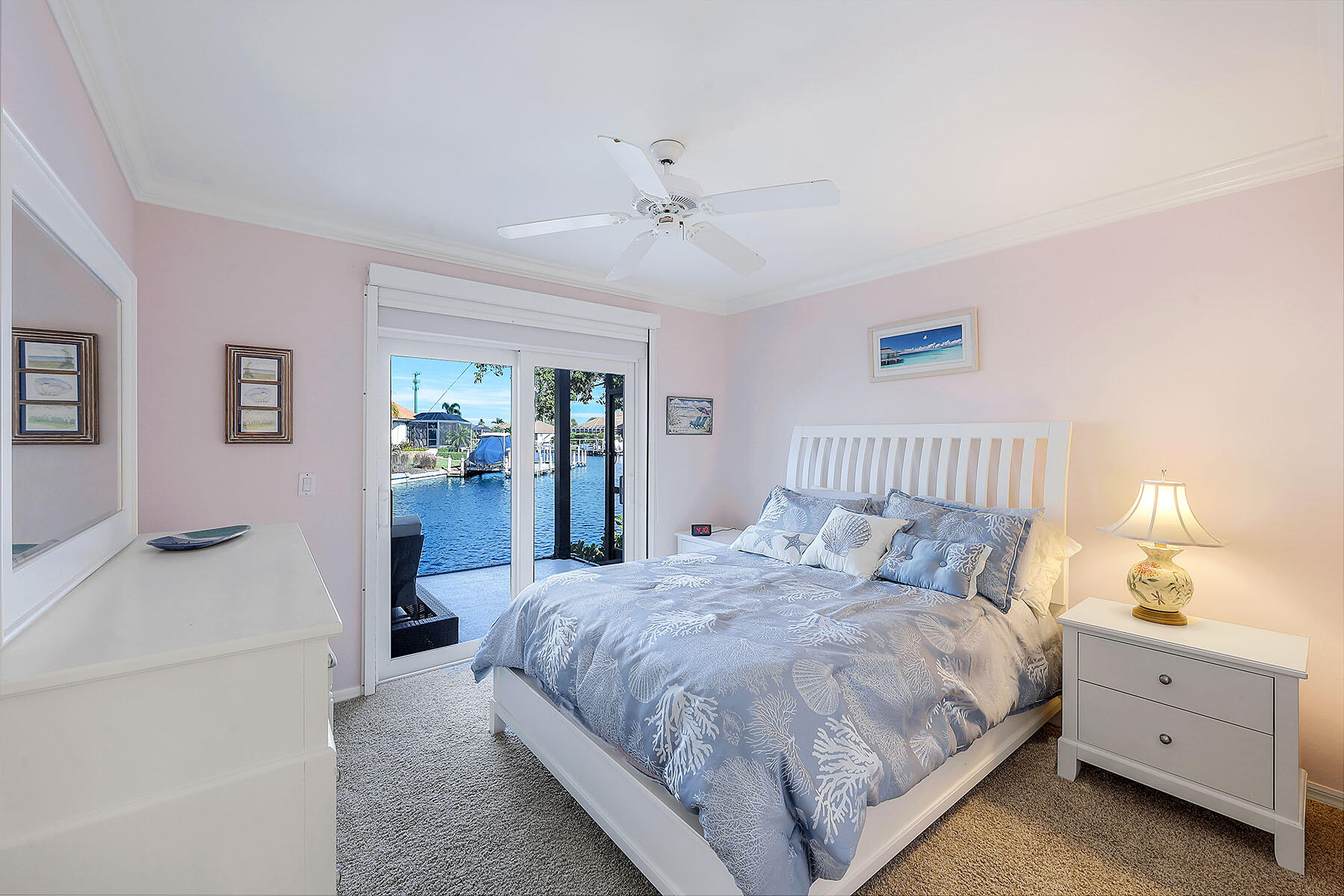 409 Waterleaf Court Marco Island, FL 34145 - Photo 18 of 38 a spacious bedroom with a bed and a couch