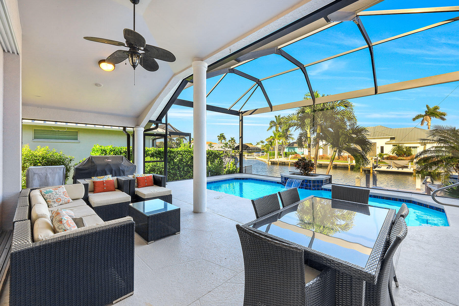 409 Waterleaf Court Marco Island, FL 34145 - Photo 22 of 38 a dining room with furniture and a floor to ceiling window