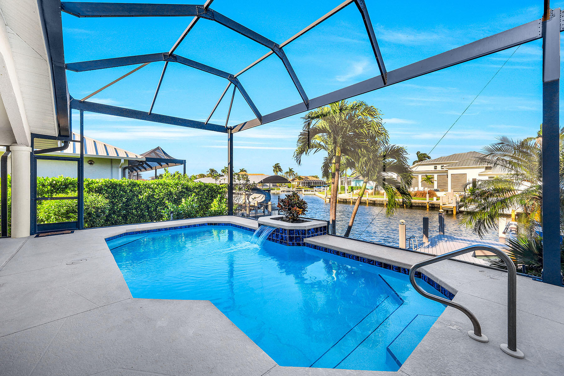 409 Waterleaf Court Marco Island, FL 34145 - Photo 24 of 38 a view of a swimming pool with a patio