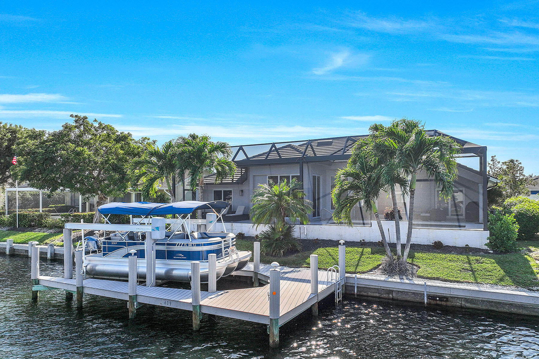 409 Waterleaf Court Marco Island, FL 34145 - Photo 32 of 38 a view of a patio with chairs and potted plants