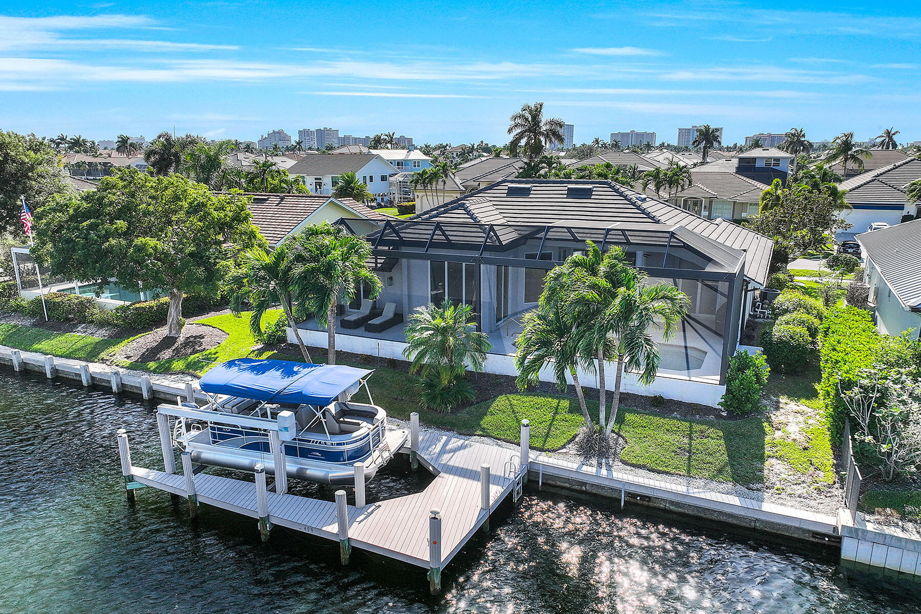 409 Waterleaf Court Marco Island, FL 34145 - Photo 33 of 38 a view of a chairs and table in patio with lake view