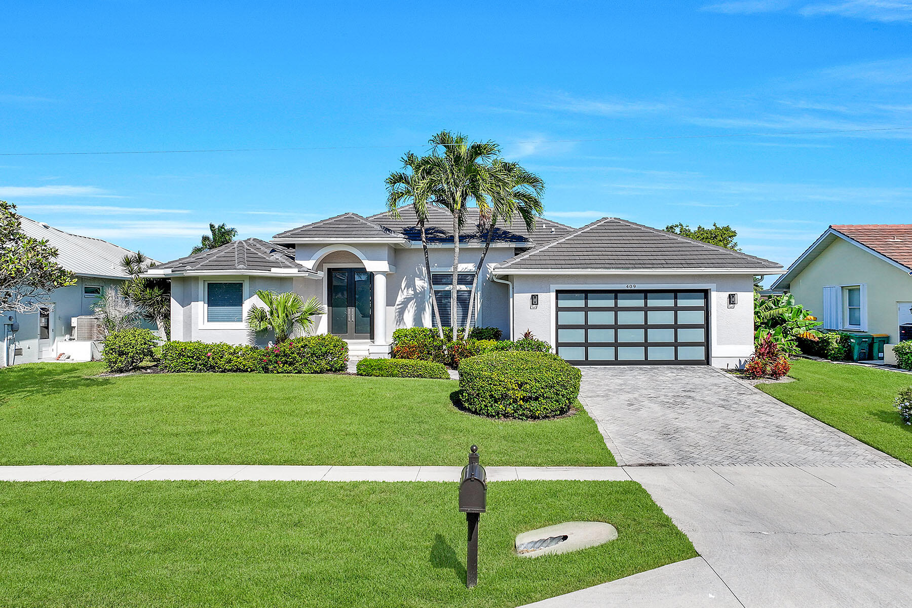 409 Waterleaf Court Marco Island, FL 34145 - Photo 37 of 38 a front view of a house with a yard