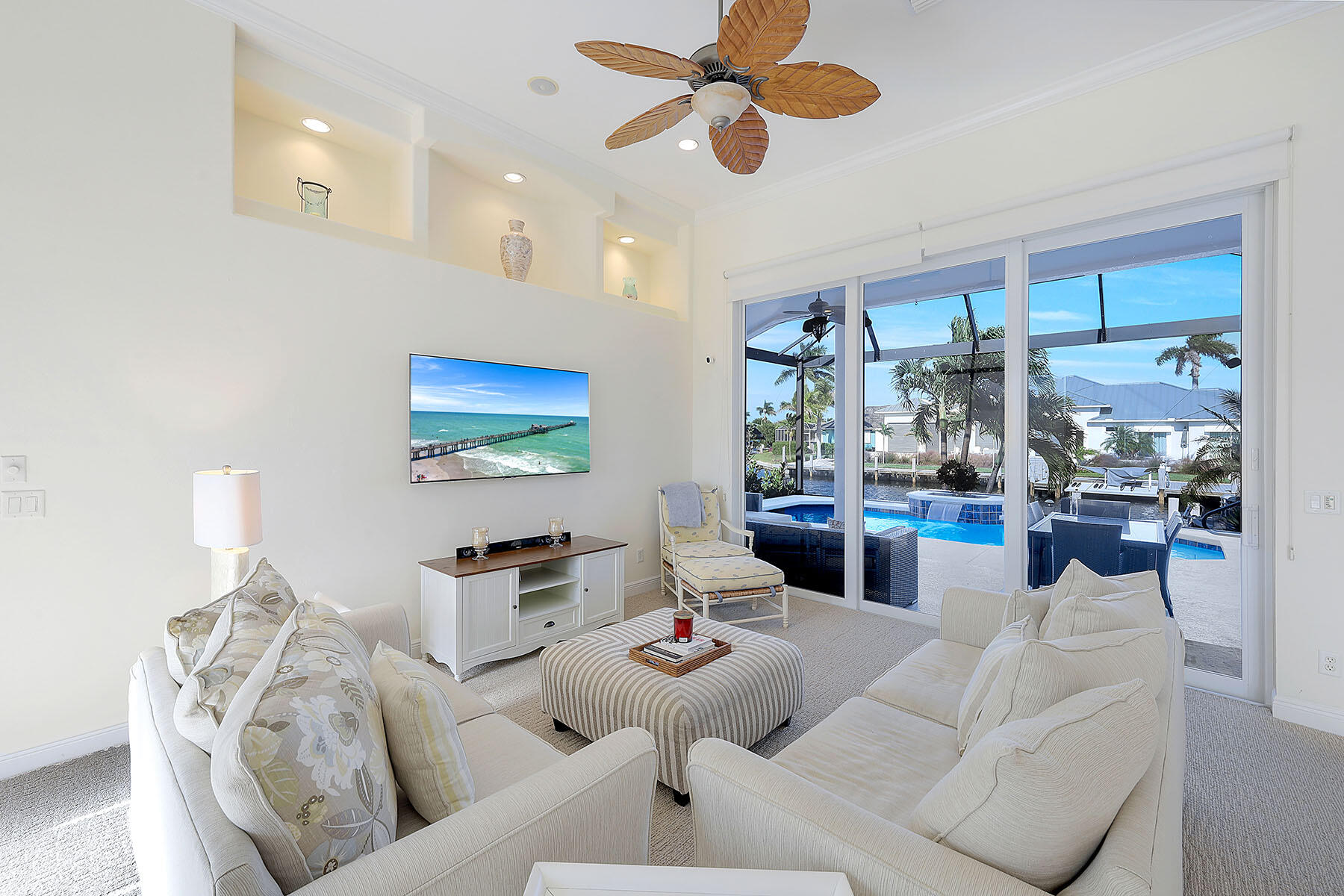 409 Waterleaf Court Marco Island, FL 34145 - Photo 4 of 38 a living room with furniture and a large window