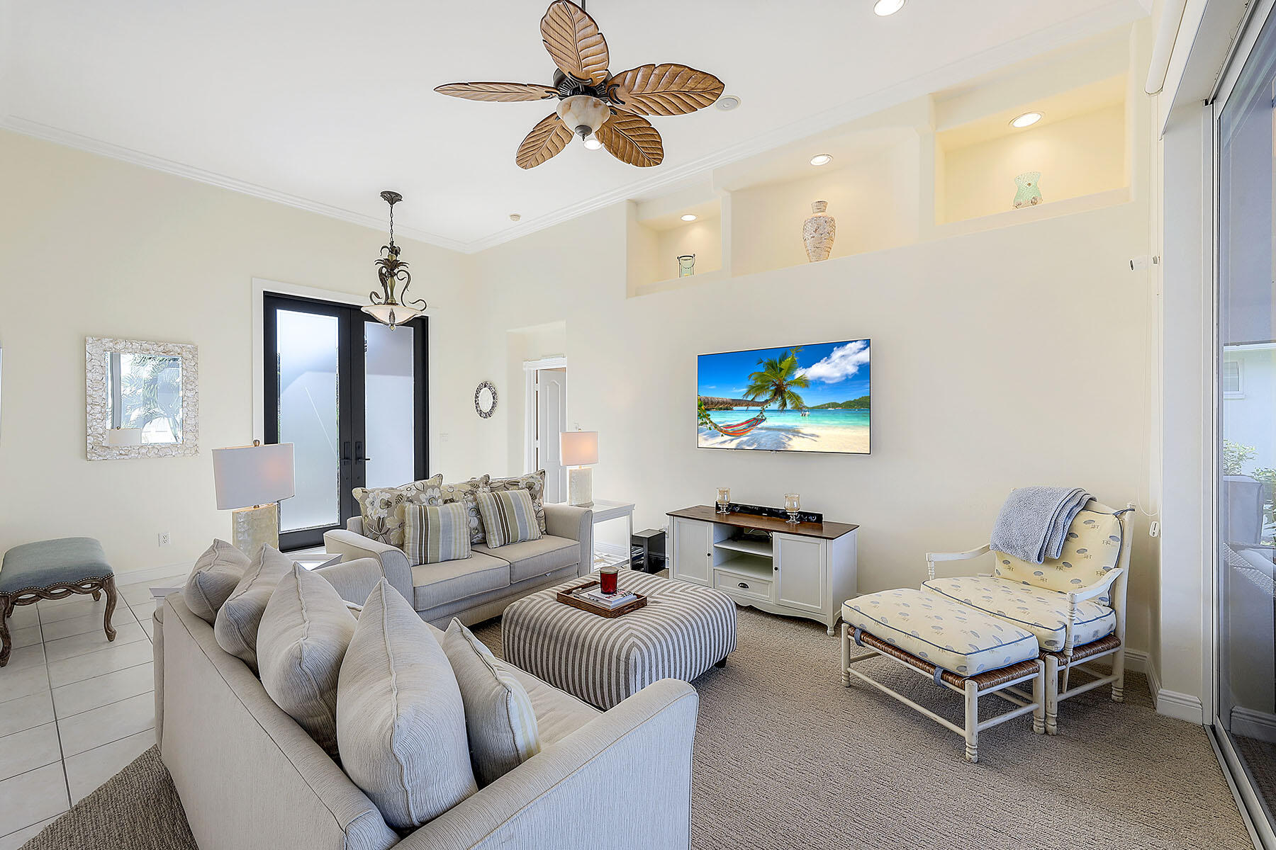 409 Waterleaf Court Marco Island, FL 34145 - Photo 6 of 38 a living room with furniture and a flat screen tv