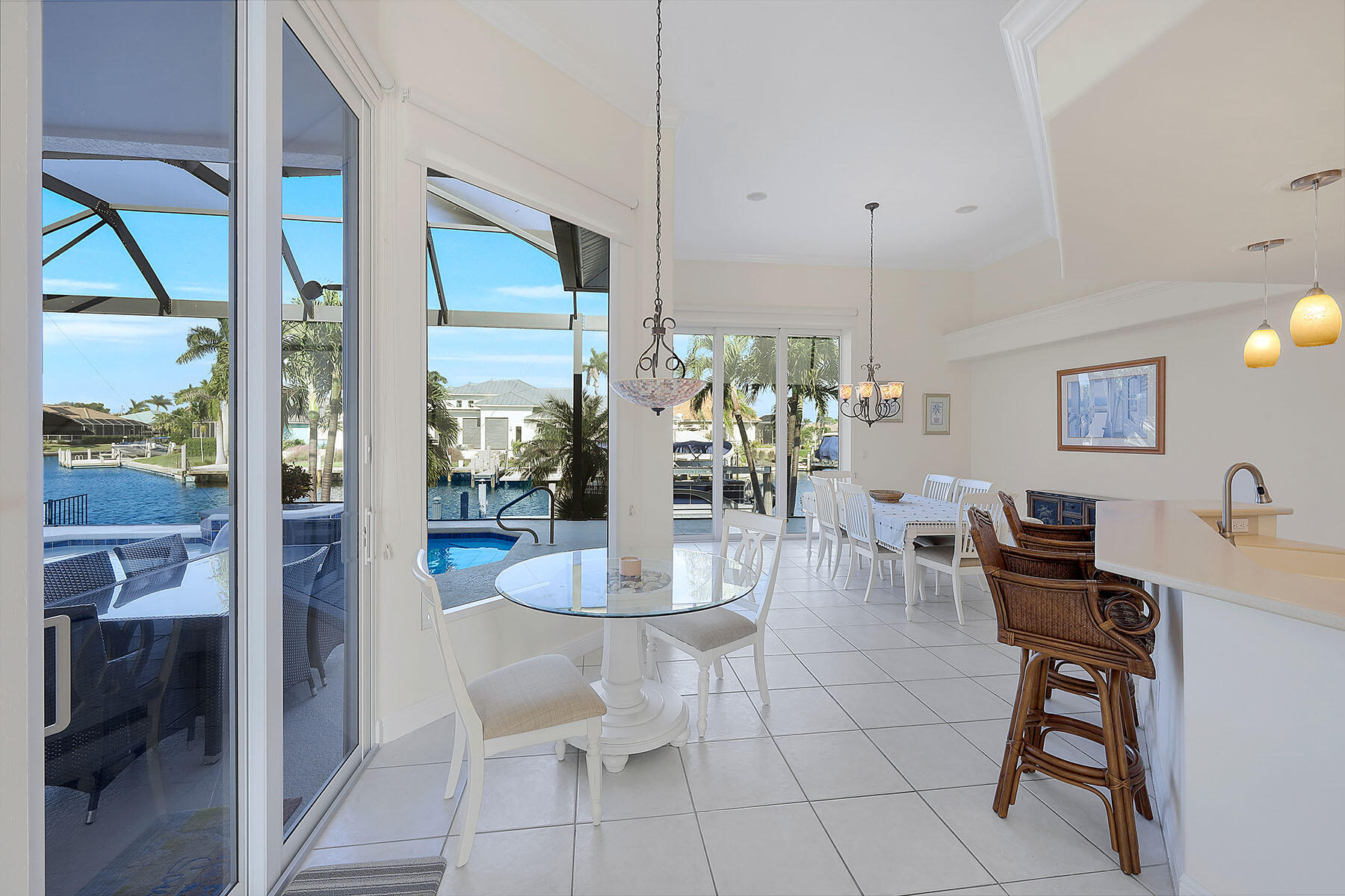 409 Waterleaf Court Marco Island, FL 34145 - Photo 10 of 38 a dining room filled with furniture and window