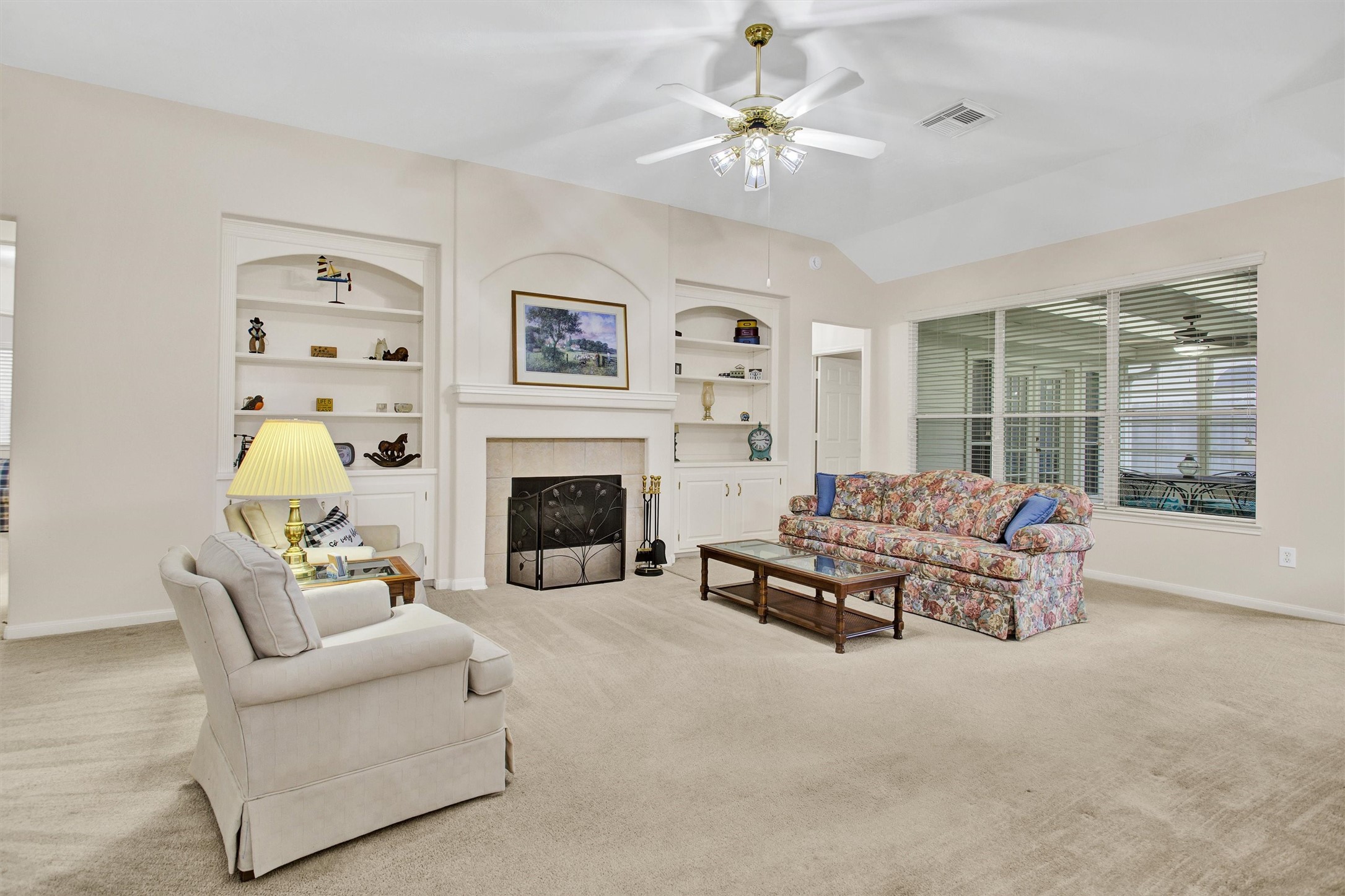 6031 Skyhaven Lane Spring, TX 77379 - Photo 13 of 33 Gas fireplace and built-ins make a cozy Den.