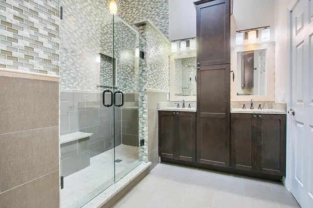 a bathroom with a shower and a sink